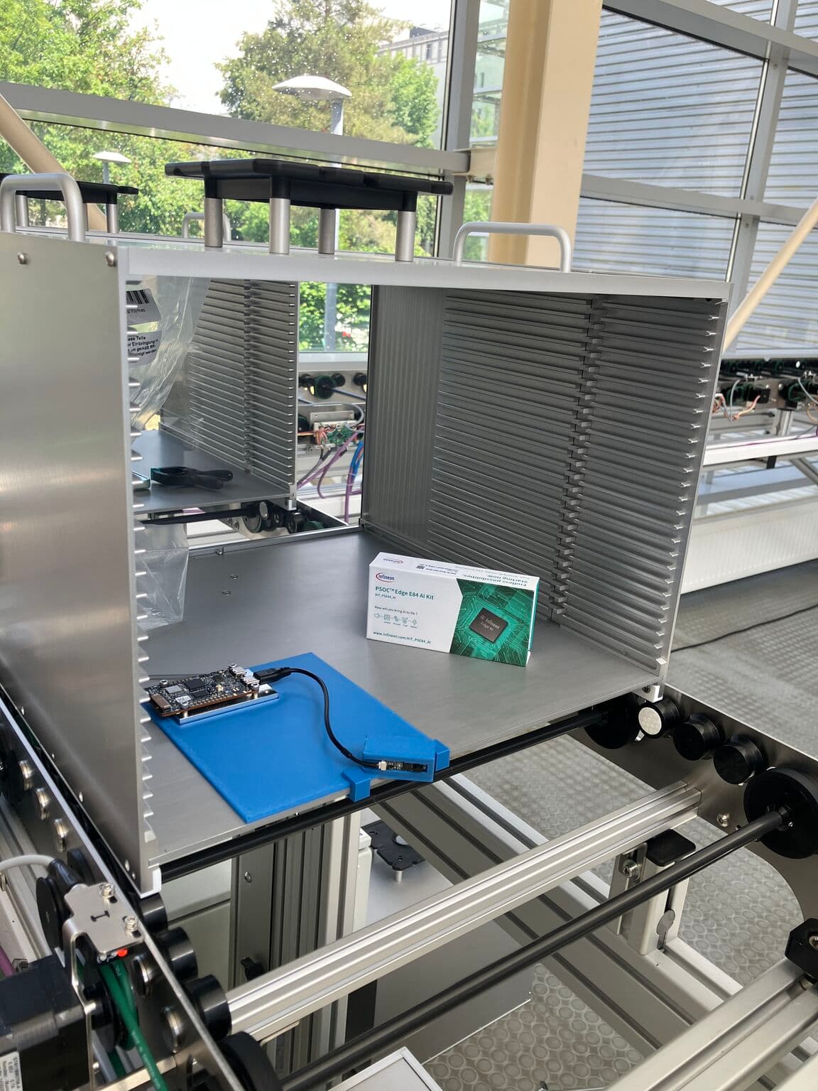 PSoC Edge kit wired up to the conveyor rig