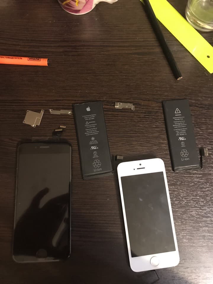 Disassembled iPhone parts laid out