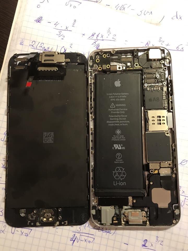 Opened iPhone showing internal components